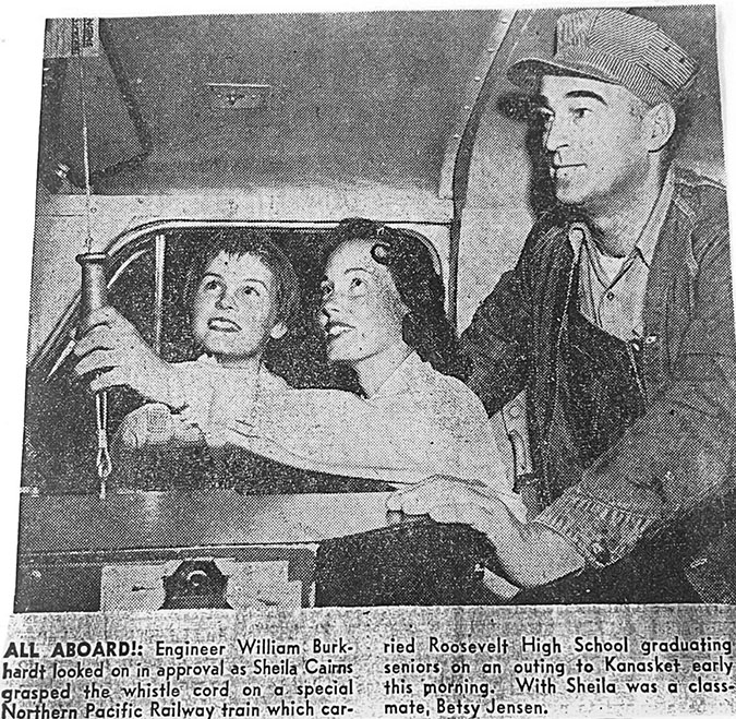 William Burkhardt Jr. shows two high school students how to pull the whistle cord in the locomotive in 1957. 