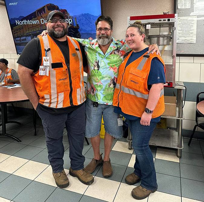 Kimberly and Matt Dunn (in orange vest) with a coworker. 