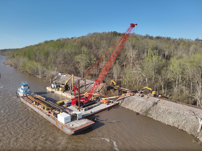 Barges are used to bring heavy equipment to the construction site.