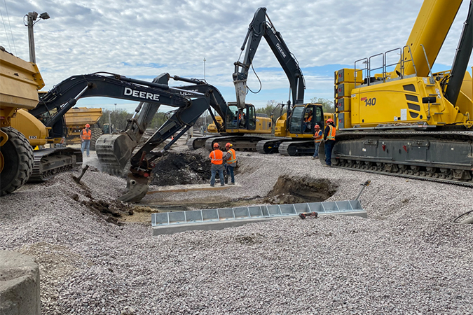 Crews excavate a space for the new scale’s foundation. The scale is used to weigh railcars.