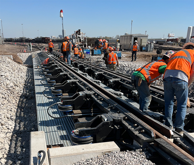 Crews working on new Group 2 bridge foundation and new Group 2 pneumatic retarder. Group 2 is a grouping of tracks within the hump yard.